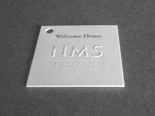 NMS Tag Duplexed and Embossed